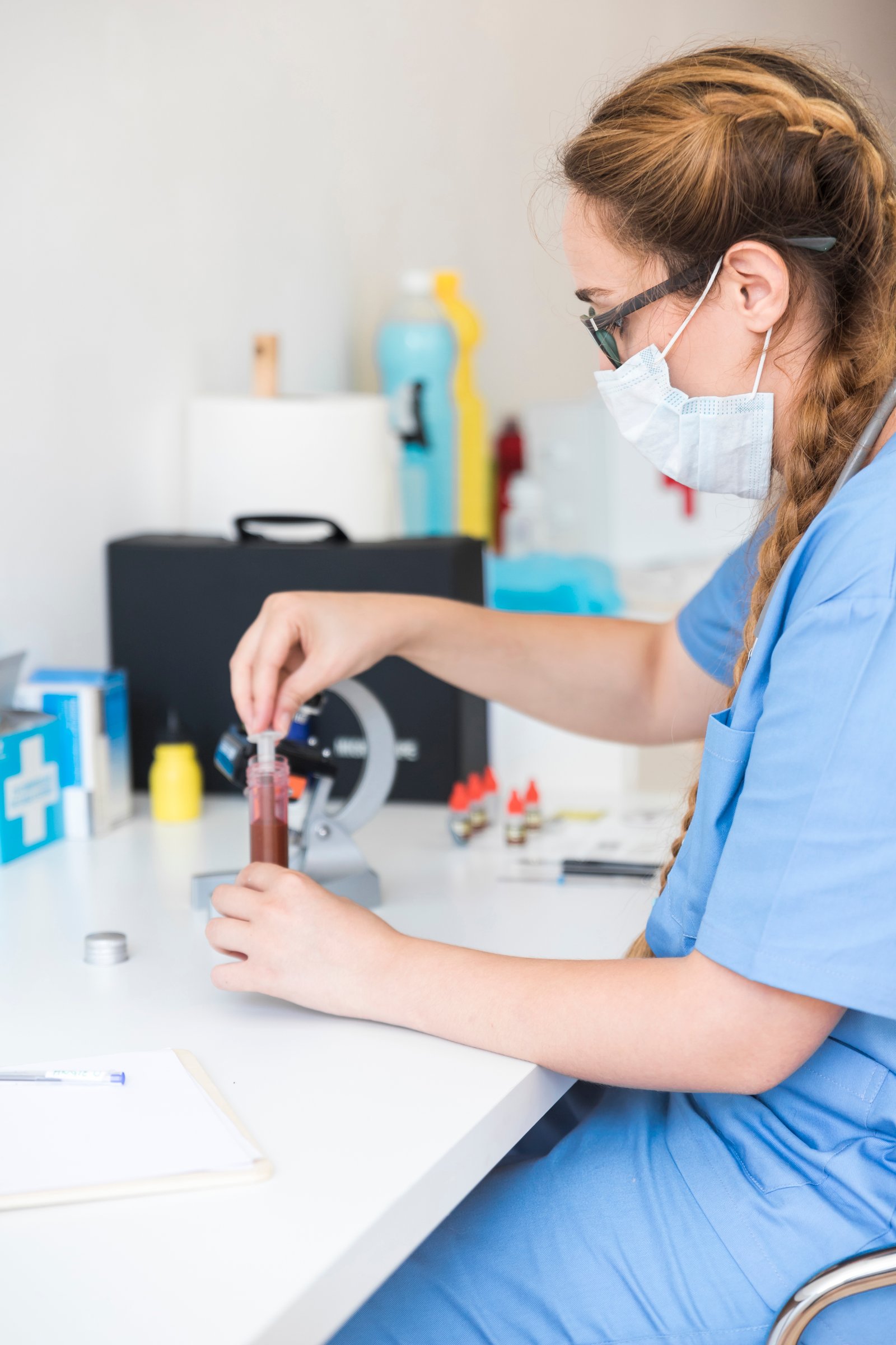 Healthcare professional collecting a blood sample at home